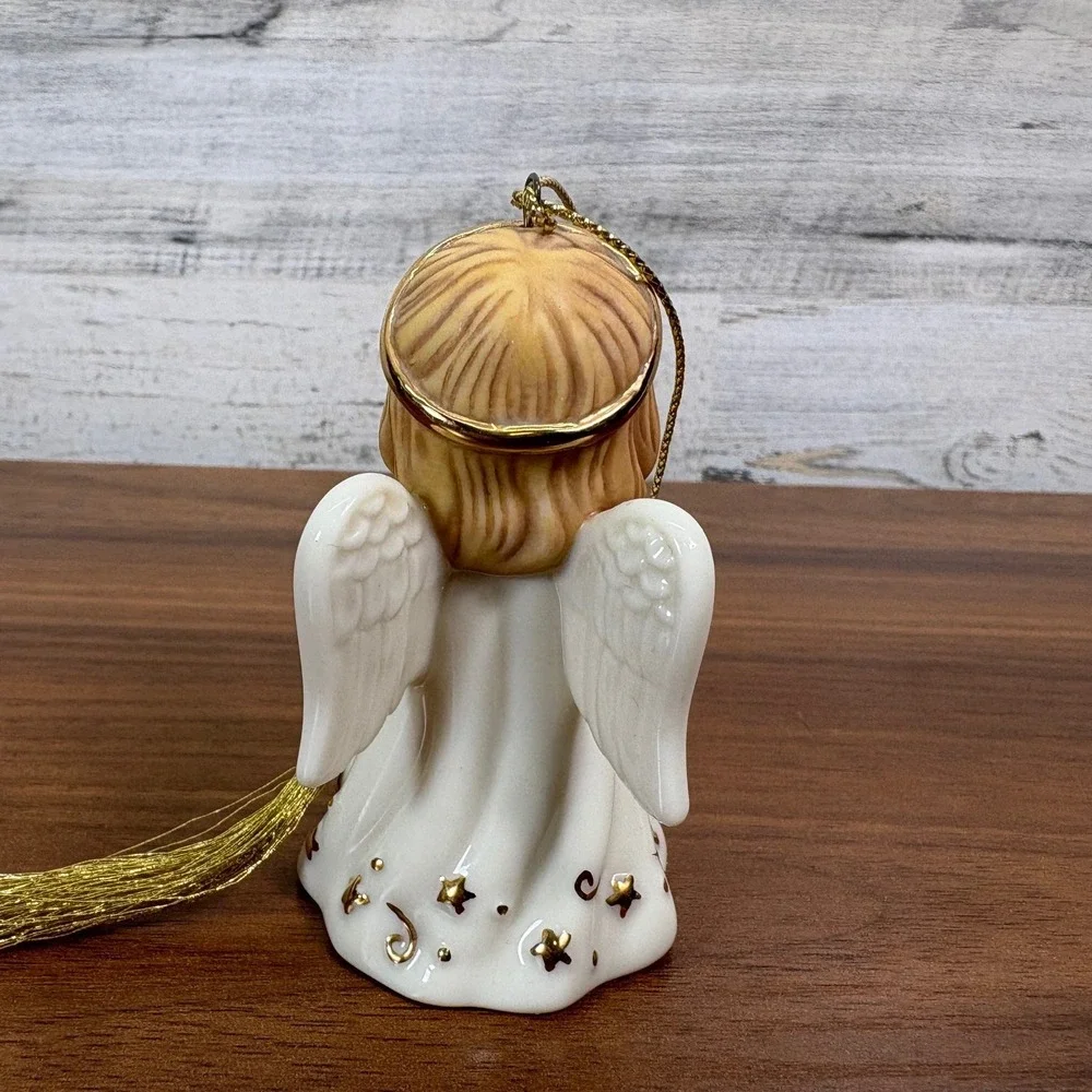 Lenox May birthstone Porcelain Angel Ornament features a hand-painted gold halo